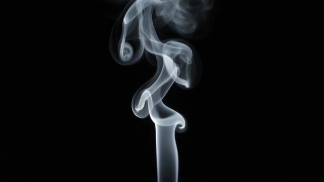 Graceful white smoke rising and swirling on a pure black background, abstract vapor pattern