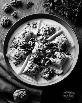 Pansoti ligurian walnut pasta in creamy herb sauce with whole walnuts