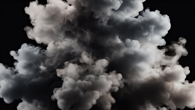 A dramatic, textured cloud of smoke or dust swirls against a stark black background, creating a visually striking and abstract composition.