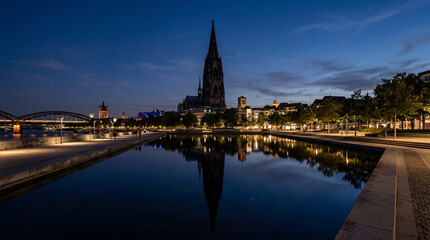 Fototapeta premium Towering Spire Silhouette With Reflective Pools for Minimal Architectural Landscape Wall Art Prints