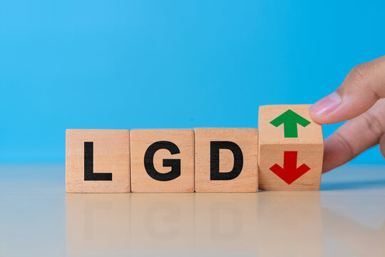 Concept Loss Given Default or LGD business acronym with cubes and downward arrow