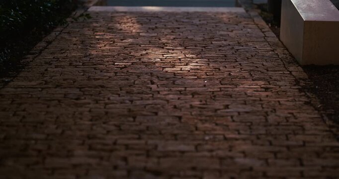 Close view of a cobblestone walkway with sunlight reflections near the ancient Pula Arena in Pula Croatia.