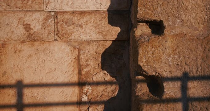 Close view of a weathered stone wall and textured architectural detail on the exterior of the ancient Pula Arena Roman amphitheater in Pula Croatia.