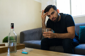 Fototapeta premium Depressed man experiencing mental health issues and sadness, coping with loneliness, stress, and anxiety