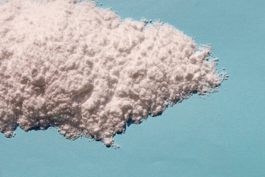 White creatine powder used as a pre-workout performance booster.