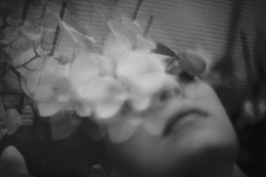 A woman with white orchid flower