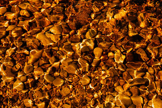 Close-up Of golden color River Waves And Ripples