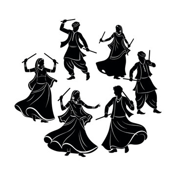 Silhouette of people performing Garba dance with sticks.