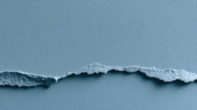 Torn paper edge in blue minimal composition, closeup macro of rough fiber and layered seam soft muted lighting highlights frayed texture and subtle shadow, creating quiet modern background ideal
