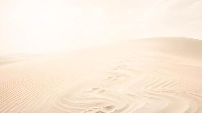 Bare footprints vanish into swirling sand ripple patterns across the desert dunes, creating a serene and minimal landscape composition perfect for cinematic backgrounds and travel concepts.