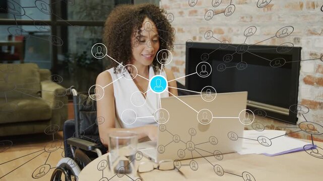Woman in wheelchair typing on laptop activating network overlay with pulsing blue dot for tech work