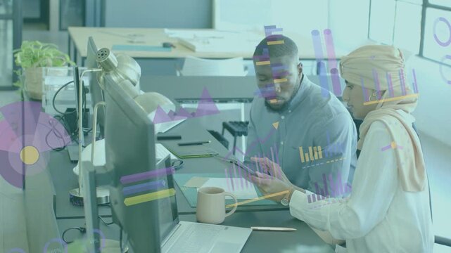 Woman tilting tablet and guiding male peer reviewing business charts with animated data overlays