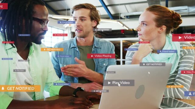 Left member pointing and typing on laptop, play and notify UI appearing over laptop, reviewing tech