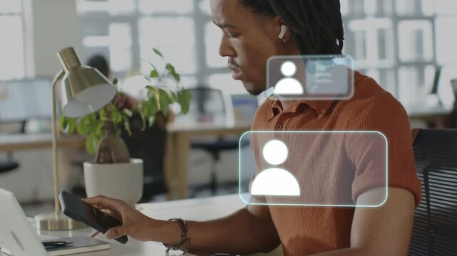 Businessman typing laptop, picking phone after seeing alerts, tapping, floating panels responding