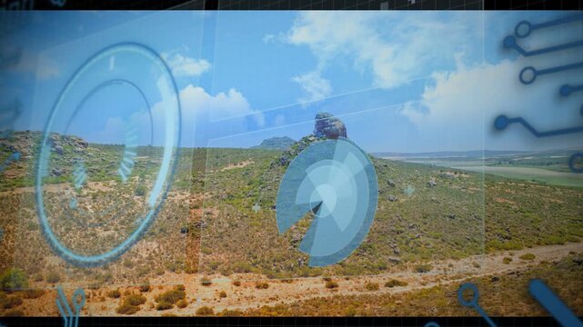 Blue HUD elements fading in, radial disc rotating and pulsing, panels sliding, framing rocky hill
