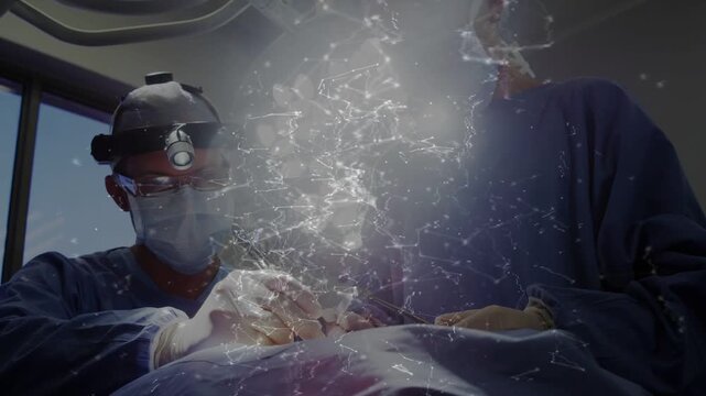 Two surgeons starting cut repairing tissue, network overlay growing then steadying over field