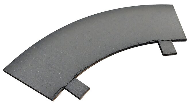 Gray curved metal plate hardware.