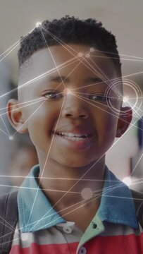 Vertical video: Child in hall, AR activating projecting HUD charts across face visualizing learning