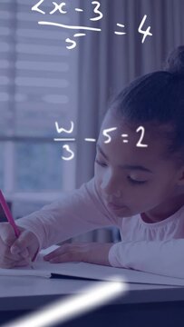 Vertical video: Child student doing homework sparking floating math equations that prompt smile