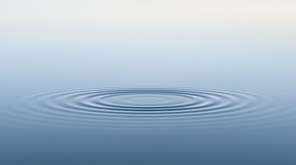 Fototapeta premium Calm water surface with gentle concentric ripples expanding outward, creating a serene and peaceful atmosphere.