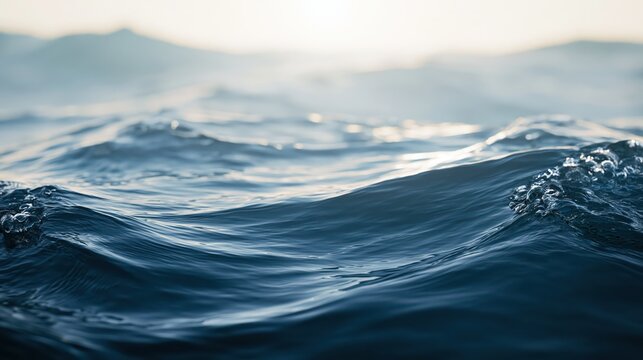 Close-up photo of ocean waves with sunlight reflecting on the water surface, creating a serene and dynamic seascape.
