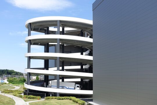 A spiral ramp in a huge warehouse , modern building