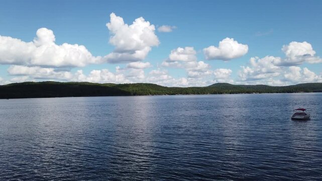 Timelapse shot during a warm summer day on Lac Simon, a beautiful recreational lake in Duhamel, Quebec, Canada.