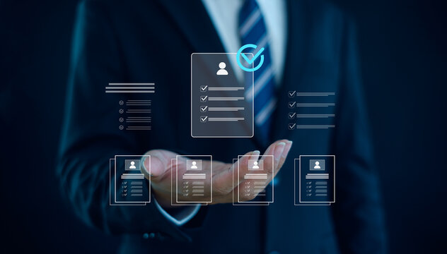 Business professional selecting digital resume profiles with verified checkmark, representing recruitment process, talent acquisition, smart hiring decisions in modern organizations.