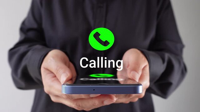 Woman holds cell phone with an animation of an incoming call