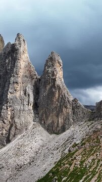 Stunning aerial motion shot of the geisler alm mountain peaks and lush green valleys in south tyrol.