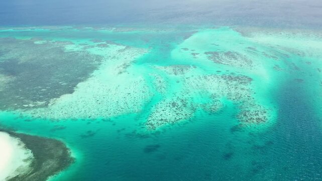 Cinematic aerial panorama of Balabac islands &ndash; Pristine tropical paradise with crystal clear turquoise water, white sandbars, and untouched nature in Palawan, Philippines