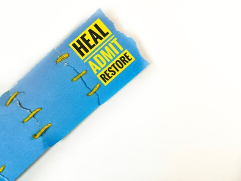 A concept of mending paper representing emotional healing. 