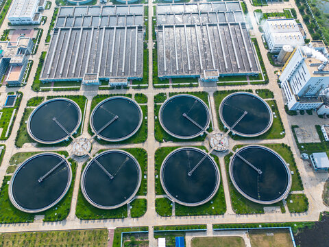 Aerial view of the Sewage Treatment Plant, Dhaka WASA featuring circular clarifiers and rectangular tanks surrounded by green spaces in Dhaka, Dhaka Division, Bangladesh.