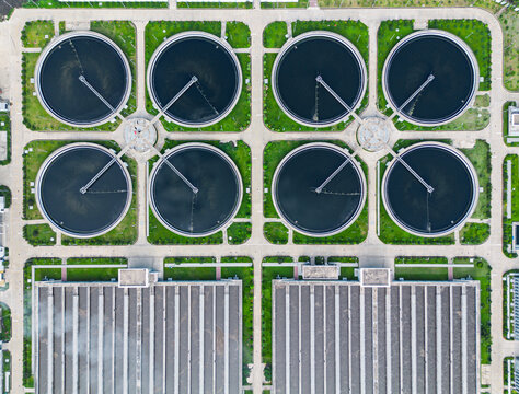 Aerial view of the Sewage Treatment Plant, Dhaka WASA featuring circular clarifier tanks and industrial buildings surrounded by green lawns in Dhaka, Dhaka Division, Bangladesh.