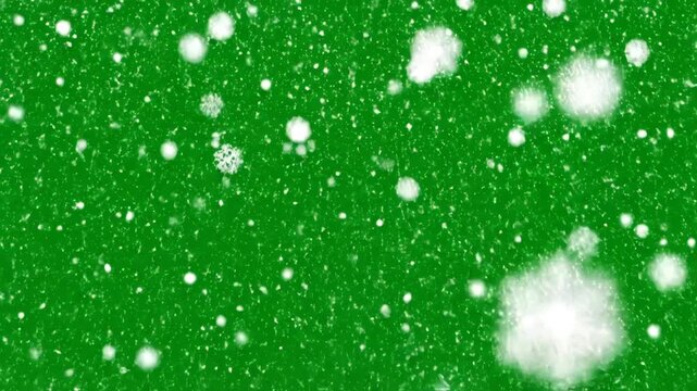 A vibrant green background is adorned with delicate, softly illuminated snowflakes gently falling, creating a serene and wintry atmosphere.