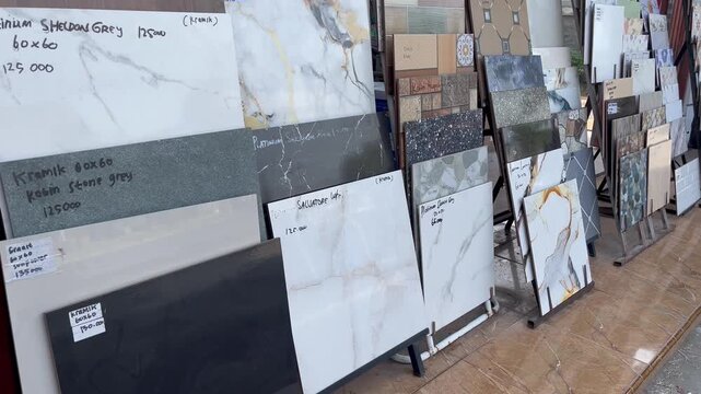 Selection of modern floor tile patterns in building material store
