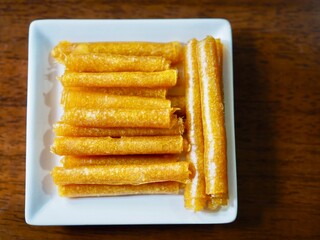 Fototapeta premium The mango paste was dried in the sun and placed on a plate. It looked appetizing and delicious.