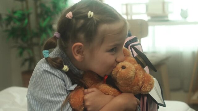 Child learning and practicing educational activity at home with support from parent in comfortable indoor environment.