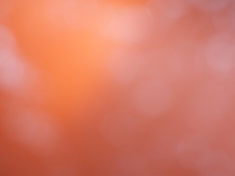 Una toma de cerca de un fondo abstracto de   color anaranjado brillante con un degradado ligero desenfocado