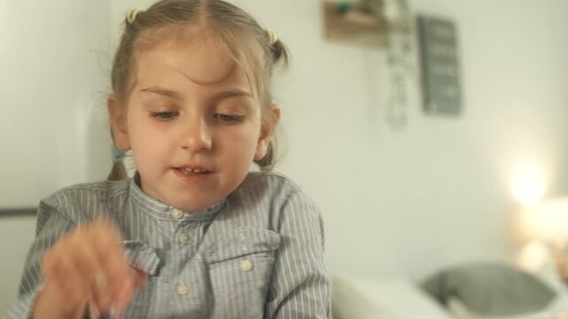 Child learning and practicing educational activity at home with support from parent in comfortable indoor environment.