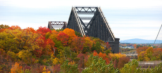 Fototapeta premium Quebec City's Old bridge seen above vibrant Autumn colours.