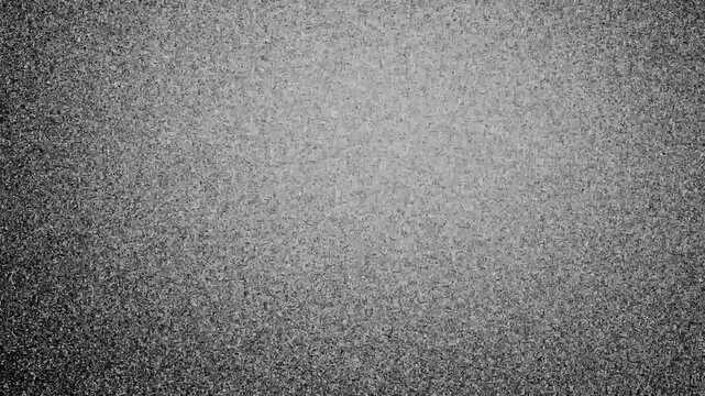 Monochrome digital noise texture with glitch effect and pixelated artifacts dynamically shifting