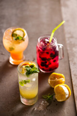 Fototapeta premium Assorted Refreshing Summer Fruit Cocktails and Lemonade with Mint and Ice