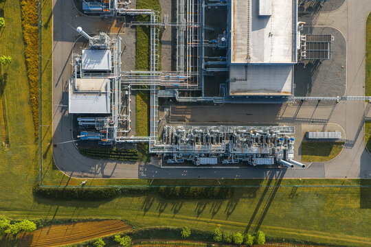Aerial view of the UGS Damborice facility with complex piping systems and industrial structures surrounded by green fields in Damborice, South Moravian Region, Czechia.