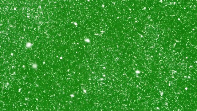 A vibrant green background is delicately adorned with a scattering of white snowflakes, creating a festive and wintry atmosphere.