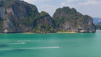 Aerial View of Limestone Karst Cliffs and Longtail Boats in Krabi