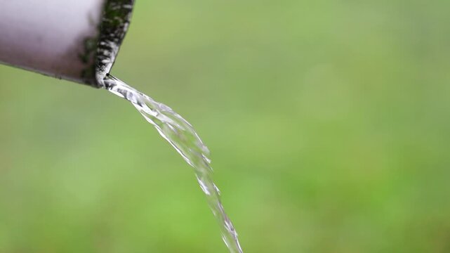 water flows out of the drainpipe