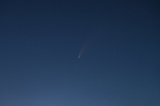 Comet with starry sky at twilight