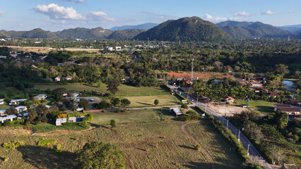 Obraz premium Aerial View of Khao Yai Landscape with Fields and Mountains