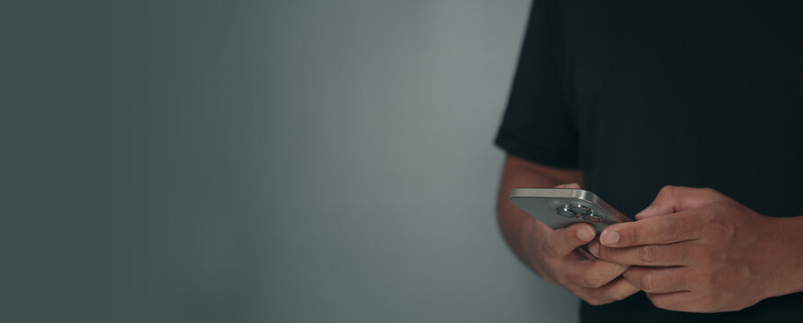 Man holding smartphone and using mobile application for online payment and financial management. Cyber security, fintech innovation, digital banking and secure transaction concept for technology backg